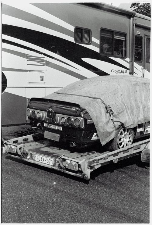 Free Black and white photo of a covered sports car on a transporter, Spa Belgium. Stock Photo
