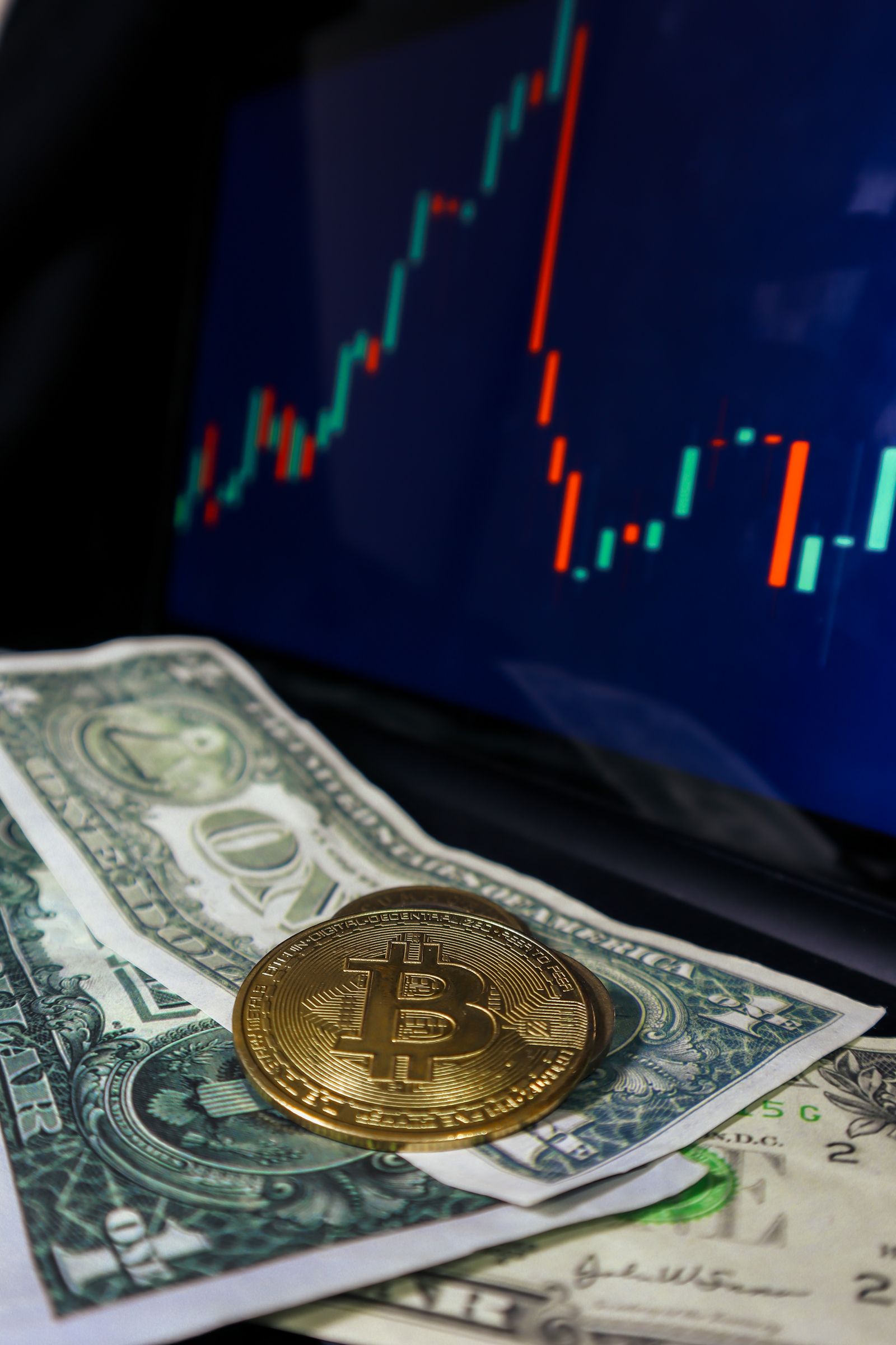 Bitcoin and dollar markets displayed on a financial trading screen