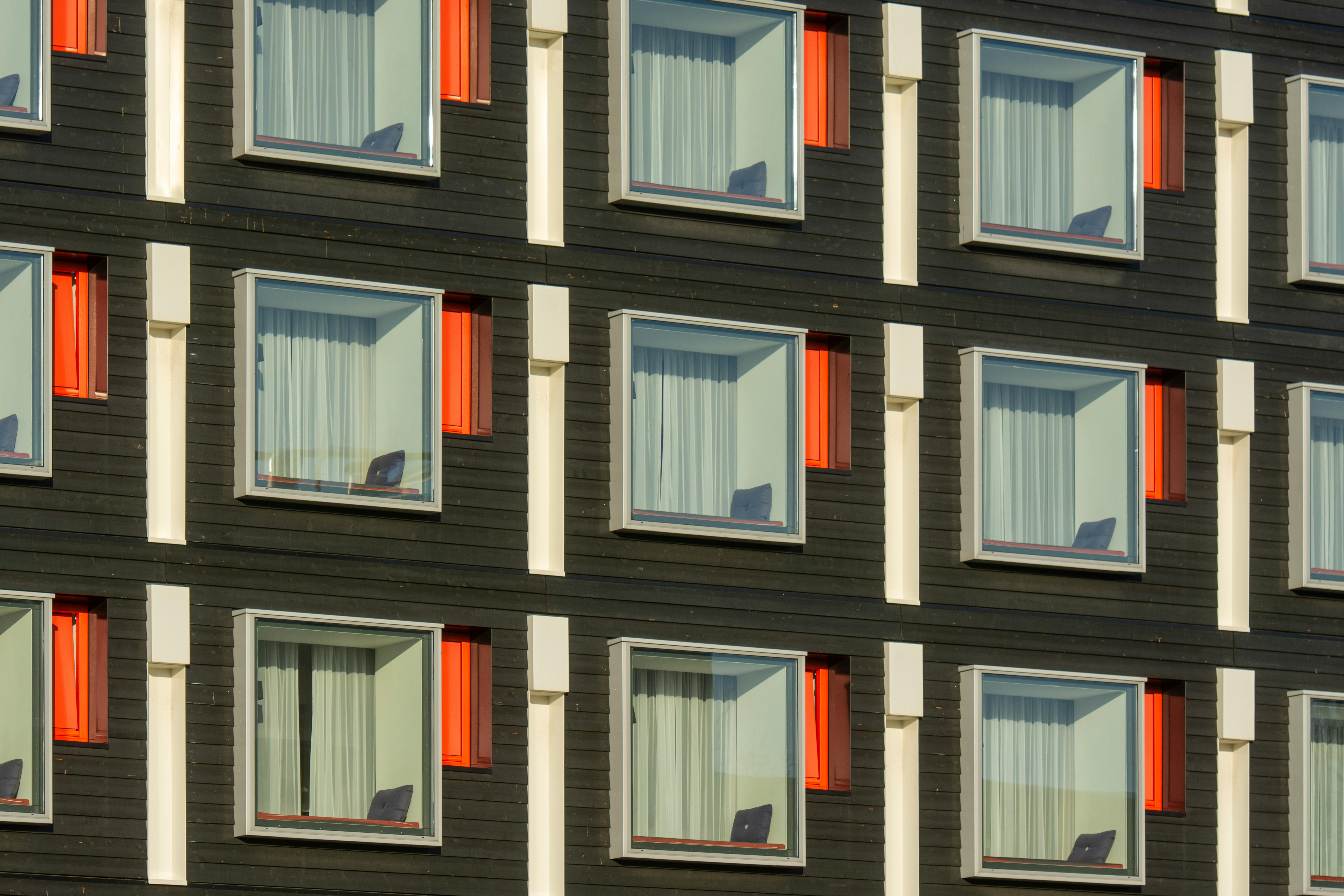 windows in facade of modern black apartment building