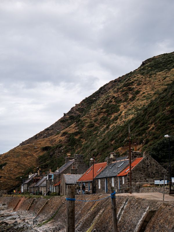 Stone houses on the shore at Crovie in Aberdeenshire Scotland before energy upgrades