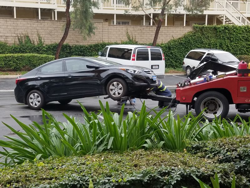 Car with a flat tire waiting for help