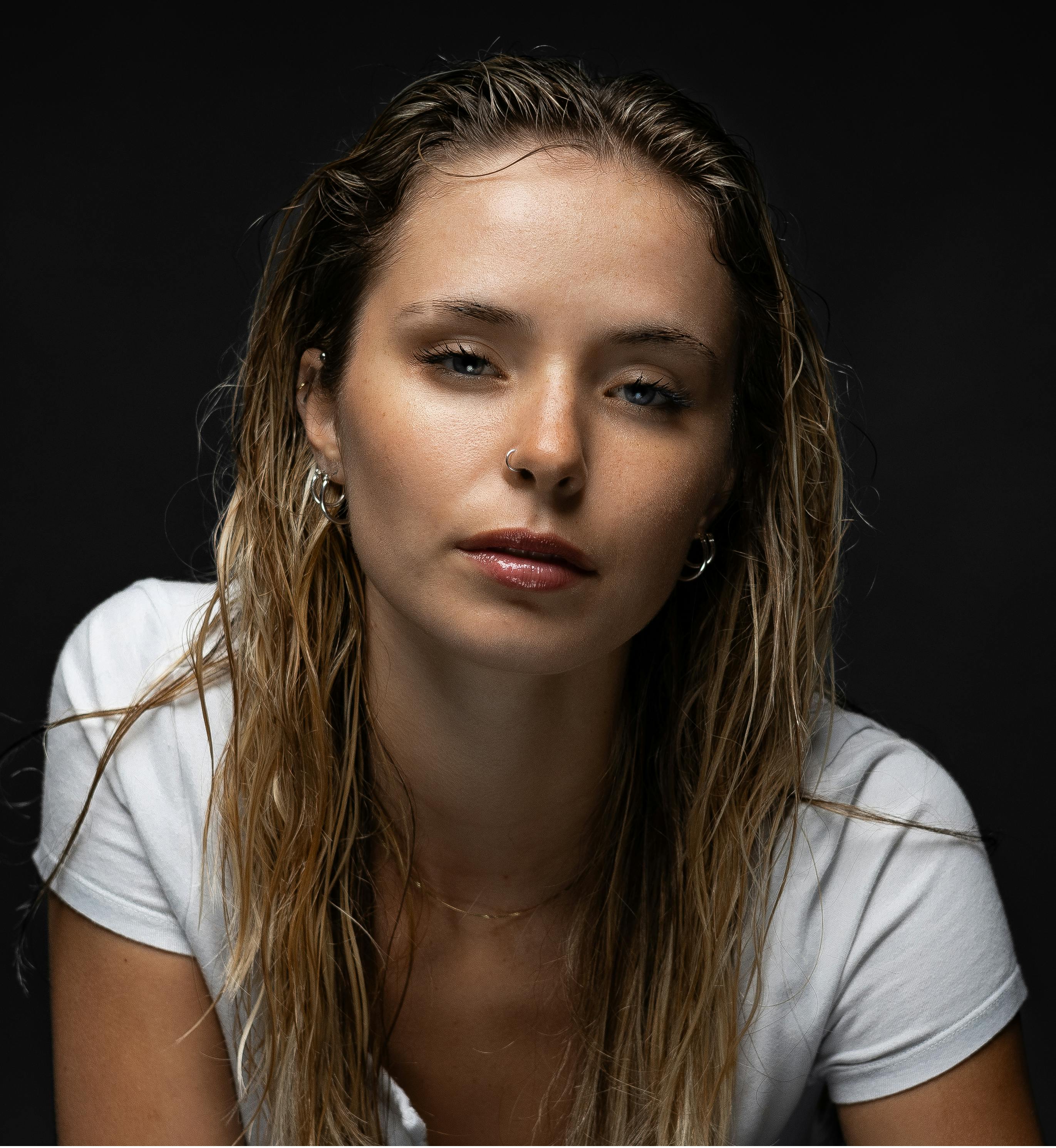 A Studio Photoshoot of a Young Woman with Wet Hair · Free Stock Photo