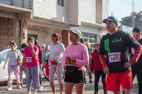 Free Competitors prepare at the starting line of a community marathon event. Stock Photo