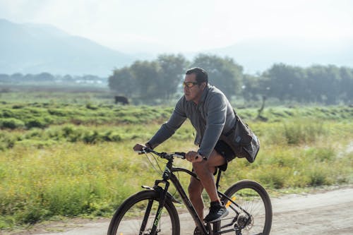 Man Riding on a Bike on a Path