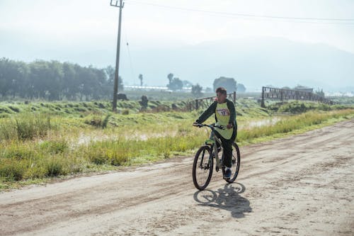 Man Riding on a Path on a Bike