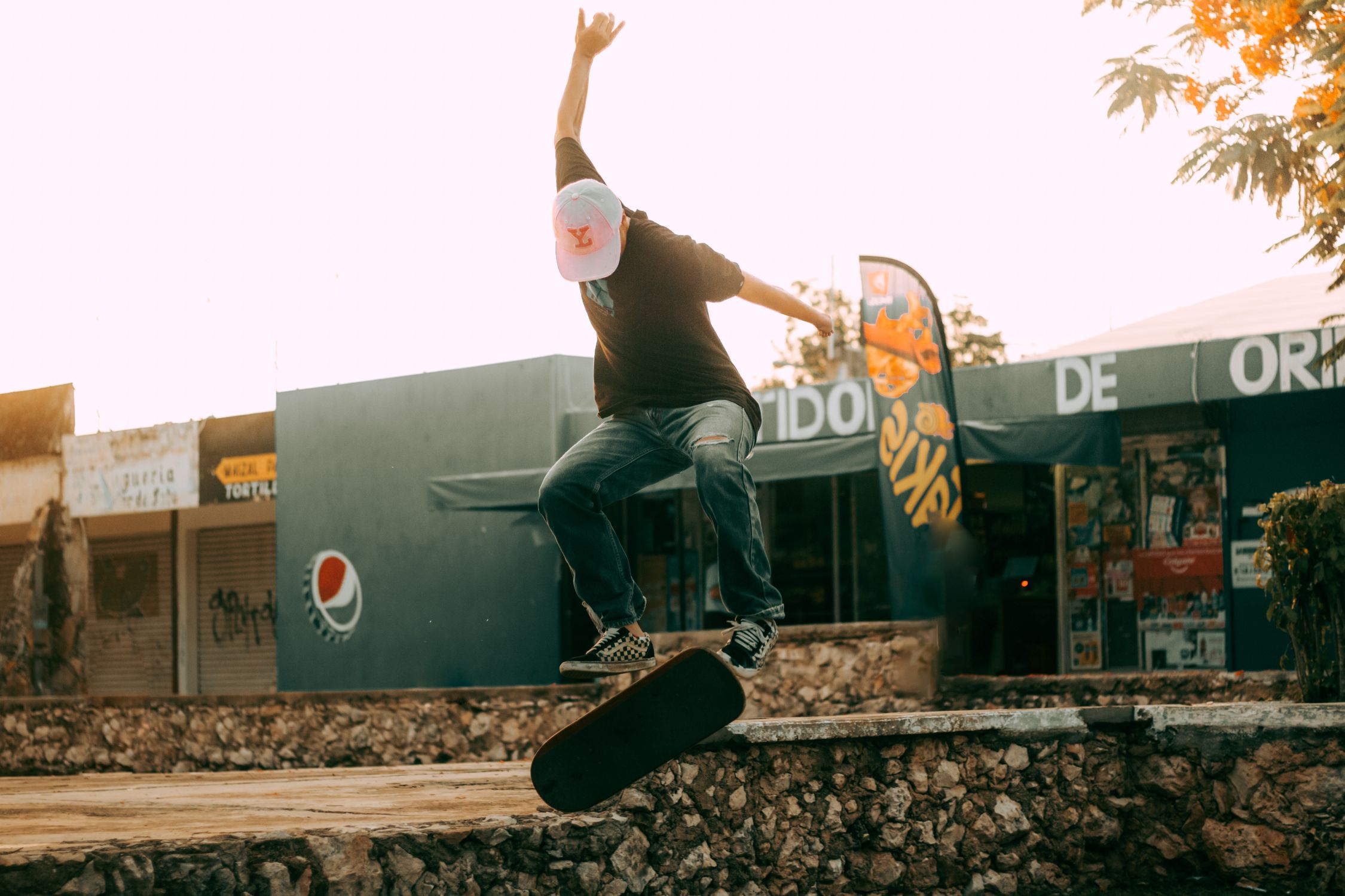 A Man Doing A Trick On The Skateboard In The Skatepark Free Stock Photo a-man-doing-a-trick-on-the-skateboard-in-the-skatepark-free-stock-photo