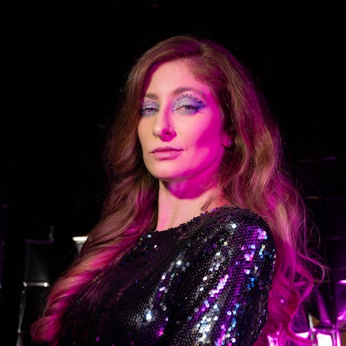 Woman in a Sequin Dress and Glamour Makeup Standing on the Stage 