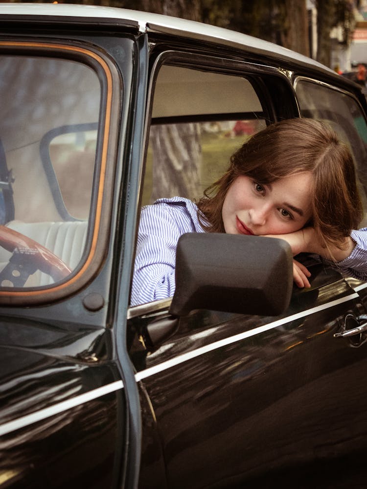 Woman Posing In Car Window