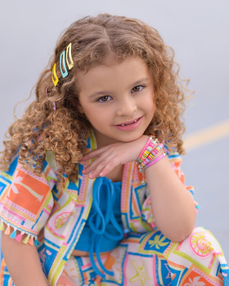 Portrait Of Smiling Girl With Curly Hair