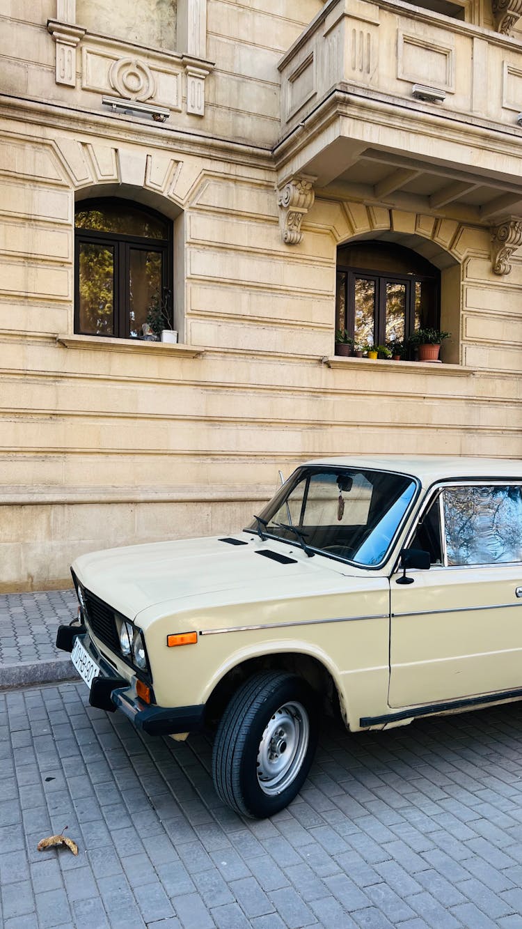 Old Car On City Street Near Classic Building