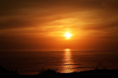 Free Captivating sunset over the Pacific Ocean viewed from the coast of Lima, Peru. Stock Photo