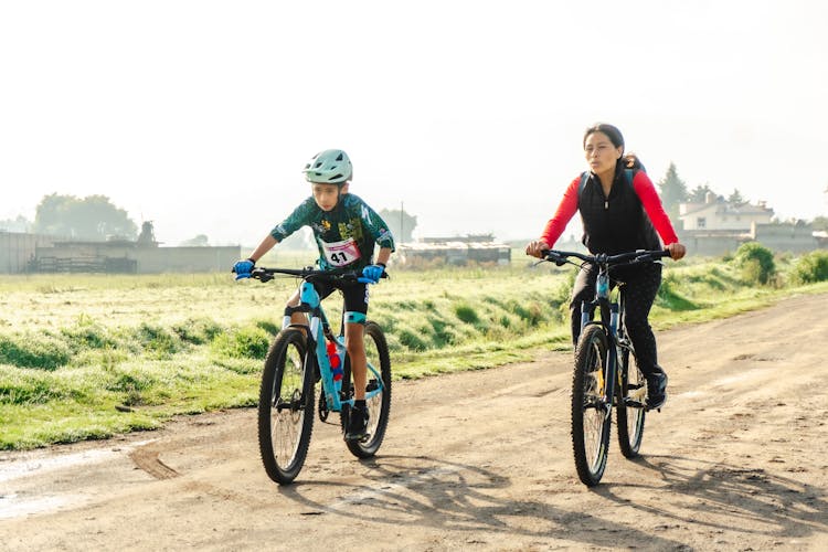 Cyclists Riding Bikes In Countryside