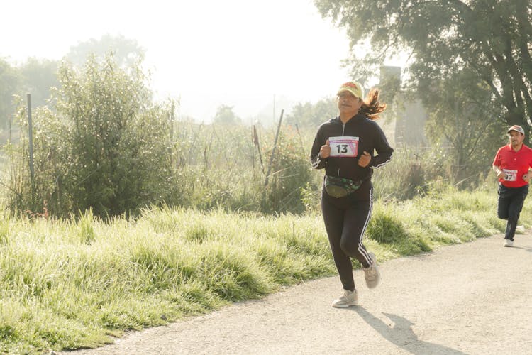 Woman Running In Race On Road