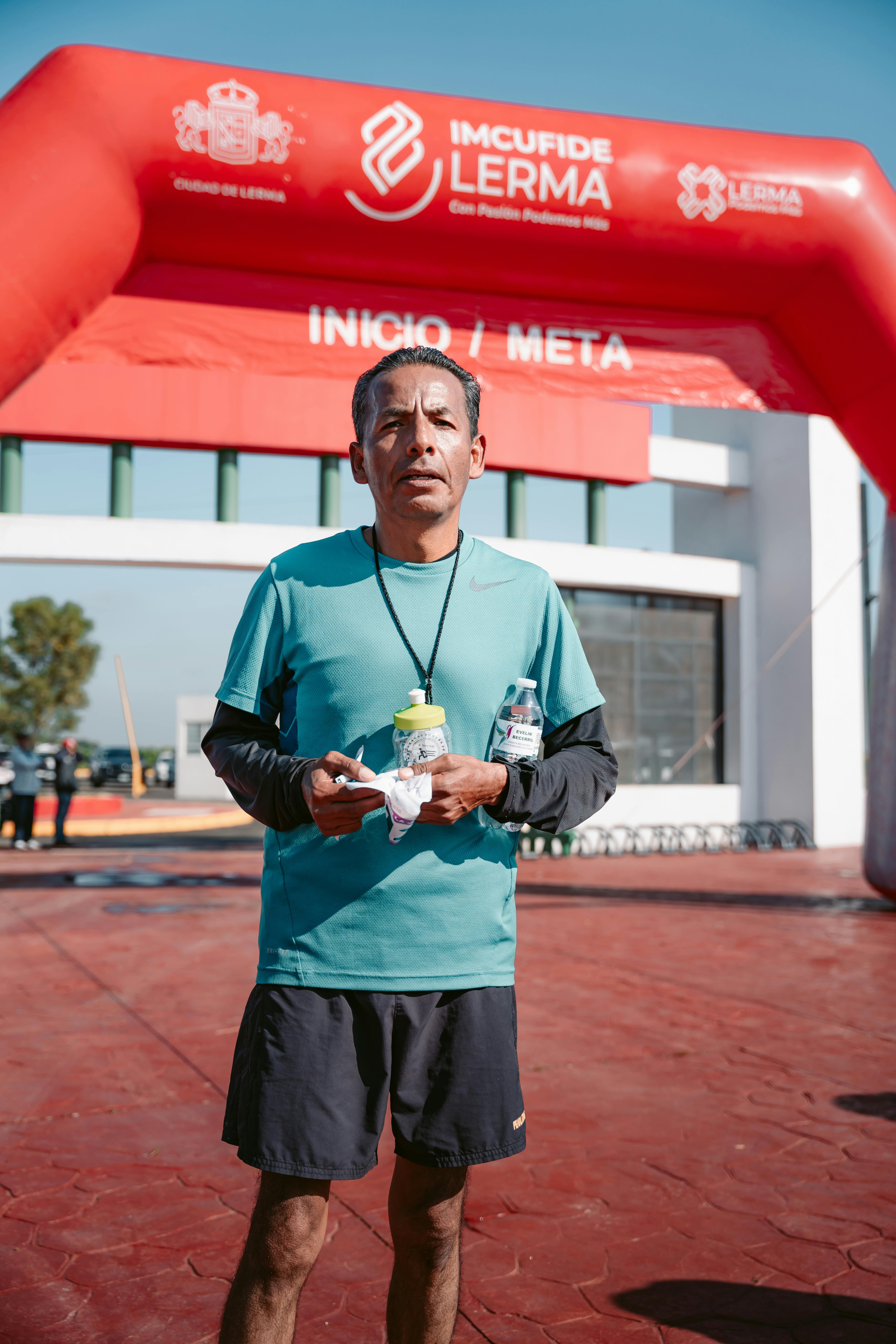 Man Standing on Finish Line with Food and Drinks · Free Stock Photo