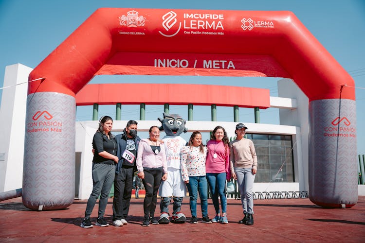 People Standing In Race Start And Finish Gate