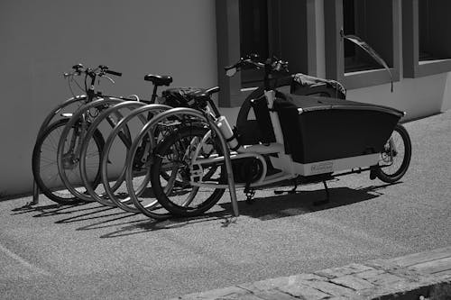 Greyscale Photo of Utility Bike during Daytime