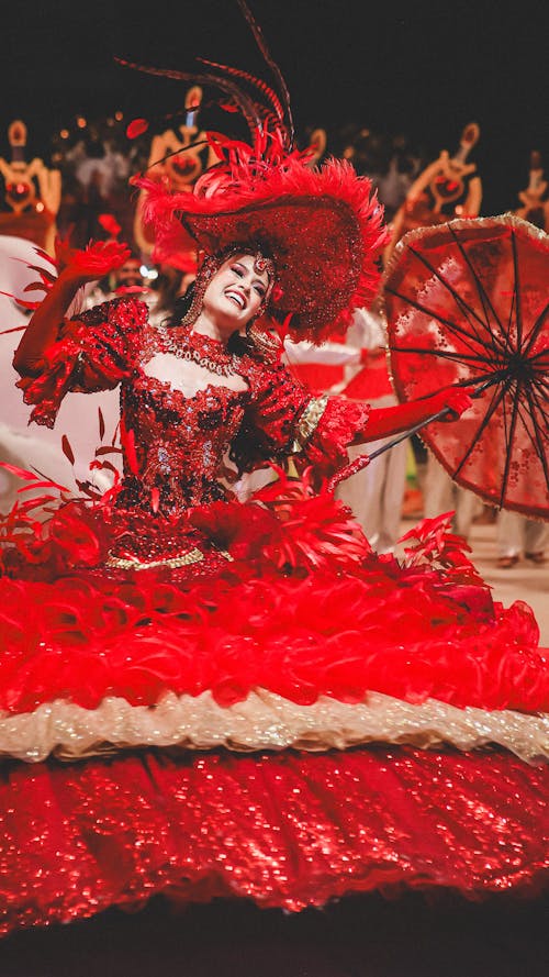 Woman Wearing Red Costume on a Parade