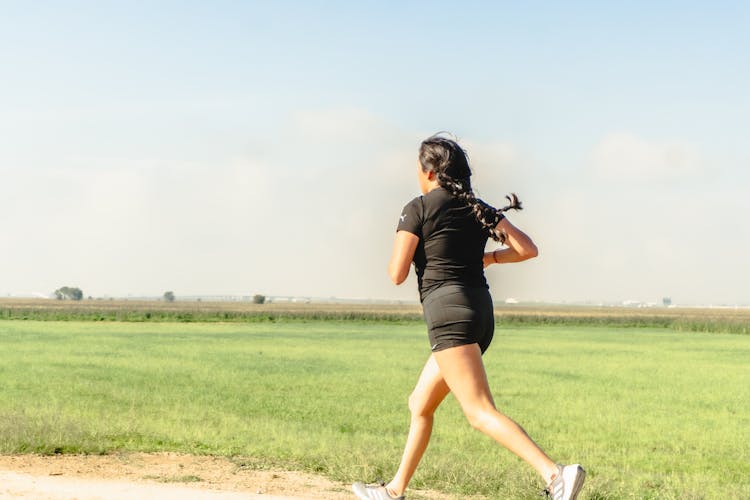 Woman Running Near Field