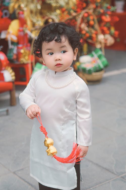 Free Child Holding Chinese Lucky Cat Stock Photo