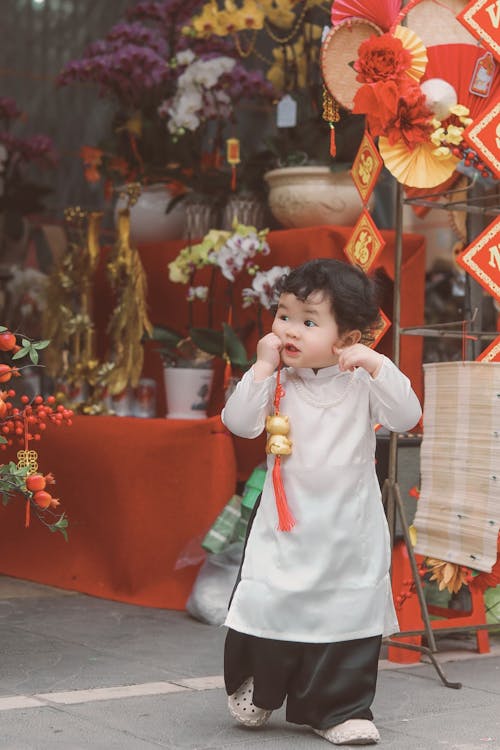 Photo of a Child and Chinese Festive Decoration