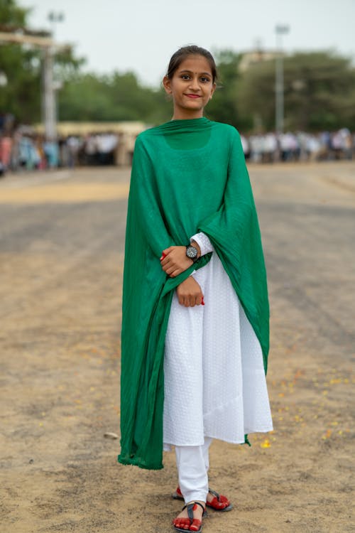 Girl Standing in Traditional Clothing