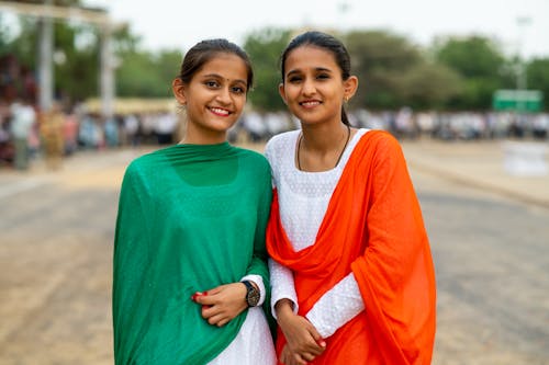 Smiling Girls in Traditional Clothing