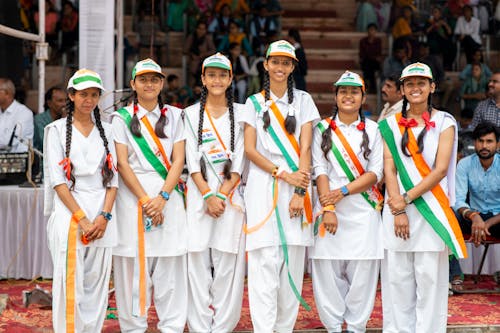 Group of Teenagers in School Uniforms Celebrating Independence Day