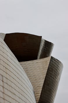 Close-up of Guggenheim Museum's modern architecture in Bilbao, Spain with unique curves.