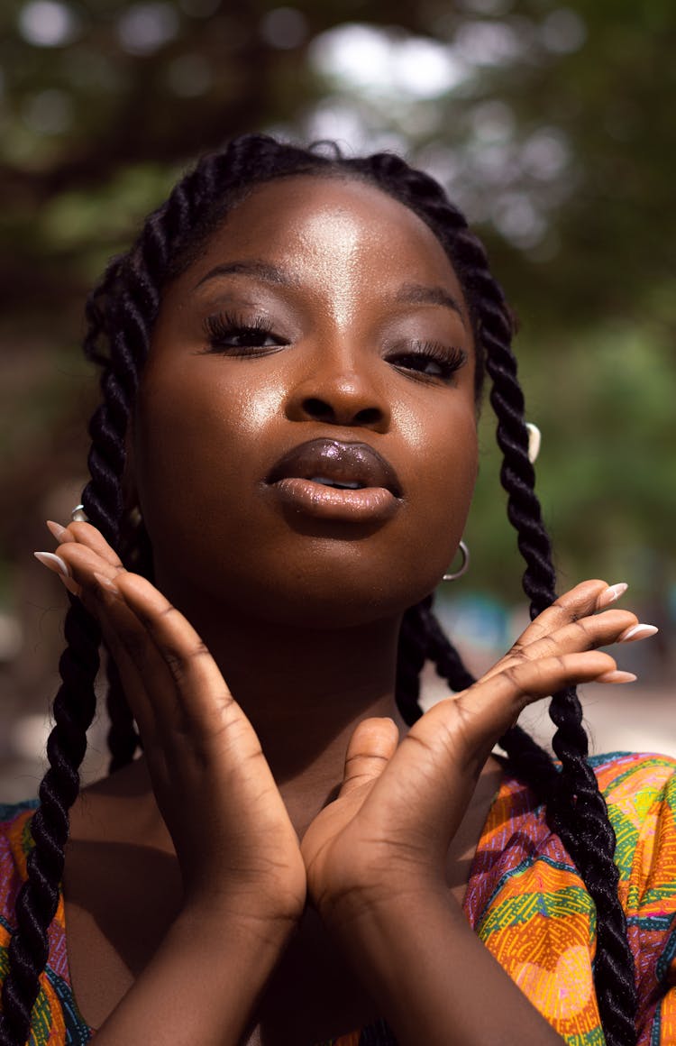 Portrait Of A Young Woman With Braided Hair Standing Outside