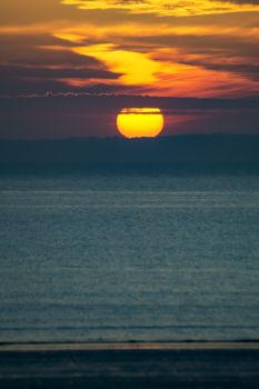 Captivating sunset over the Plonévez-Porzay coastline in Brittany, France.