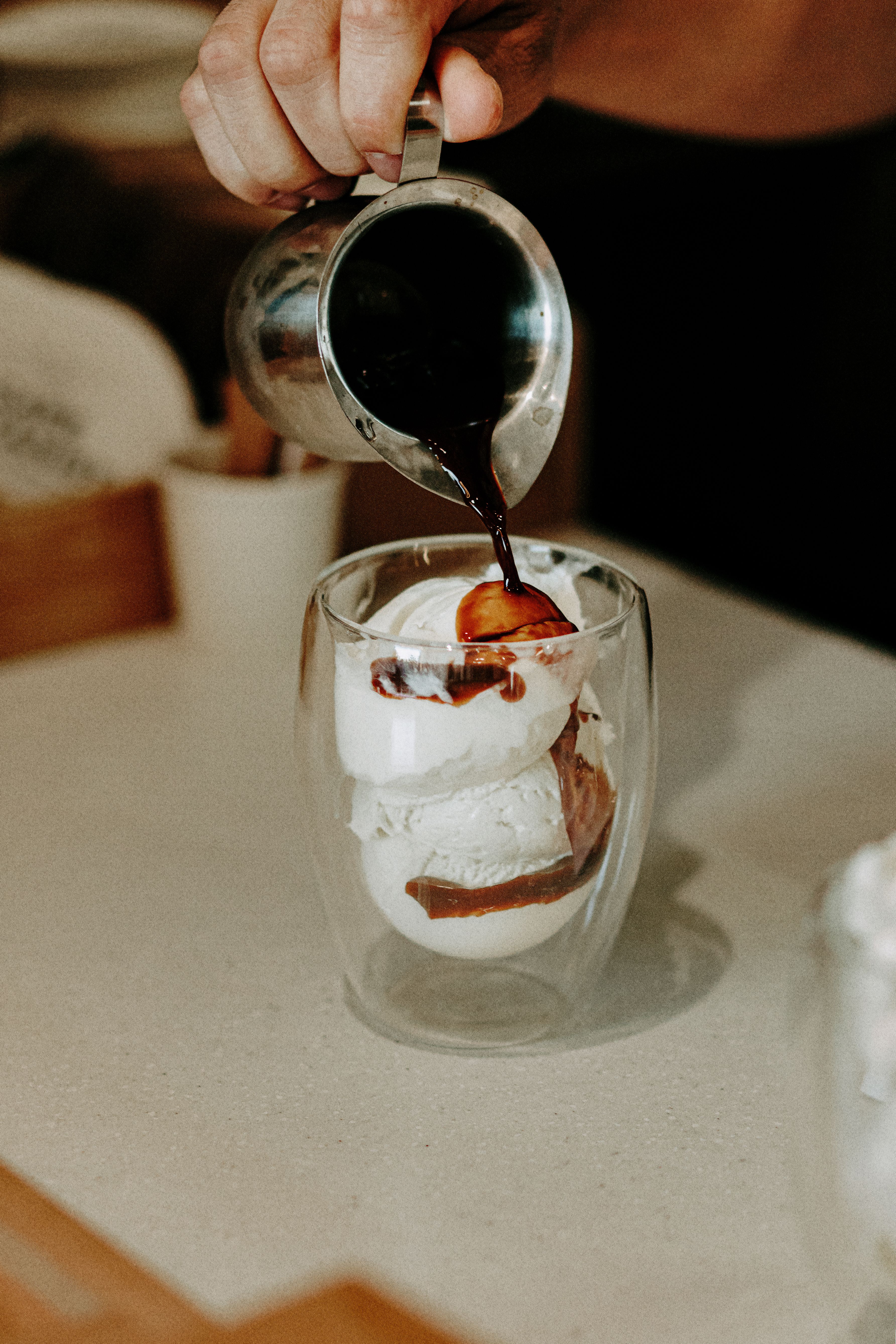 person-pouring-coffee-on-ice-creams-free-stock-photo