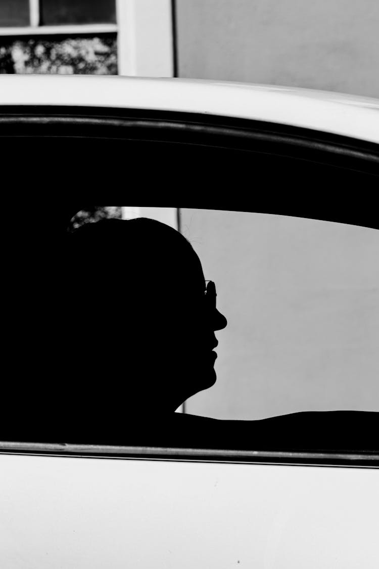 Silhouette Of Man In Car