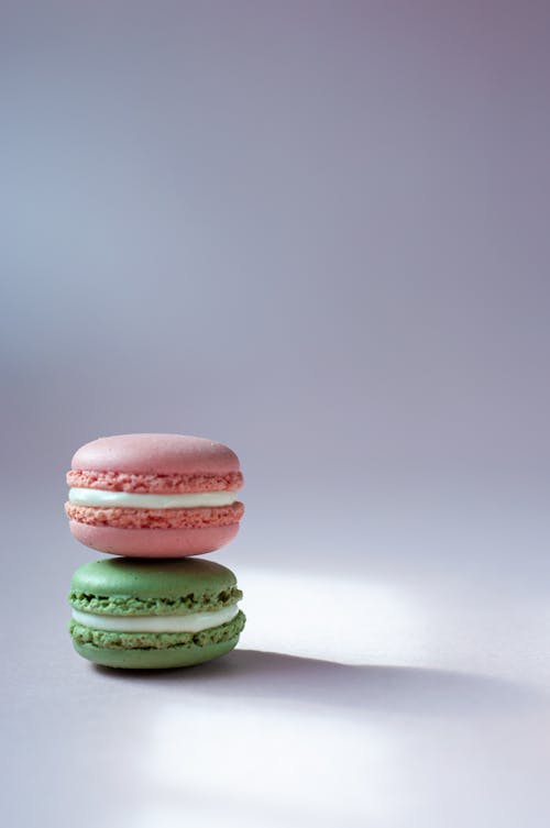 Pink and Green Macarons on White Background