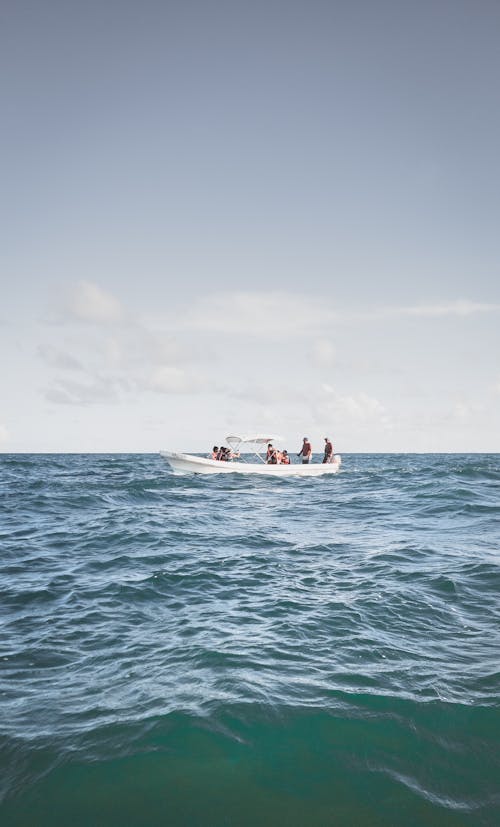 View of People in a Boat on a Sea 