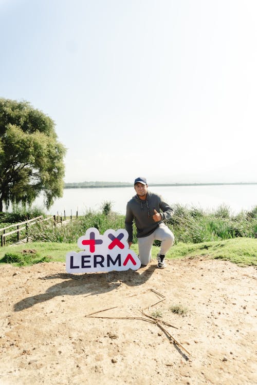 Man with Sign on Sand