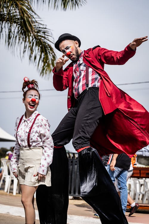 Woman and Man in Clowns Costumes