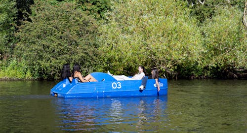 Four girls out on a pedalo