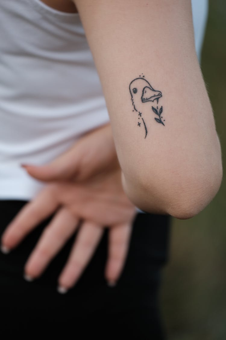 Duck Tattoo On Woman Arm