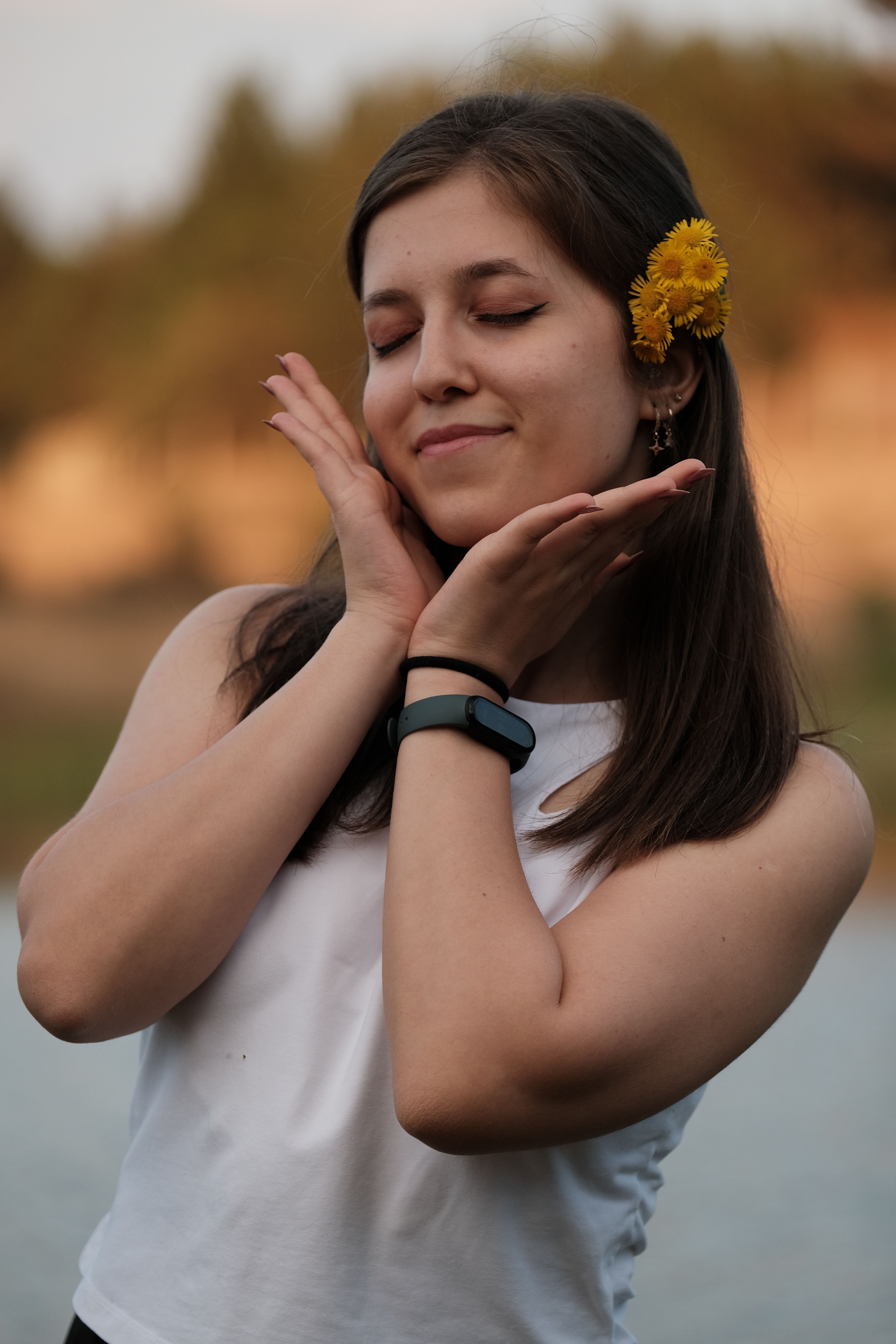 Smiling Young Woman with Flowers in Hair · Free Stock Photo