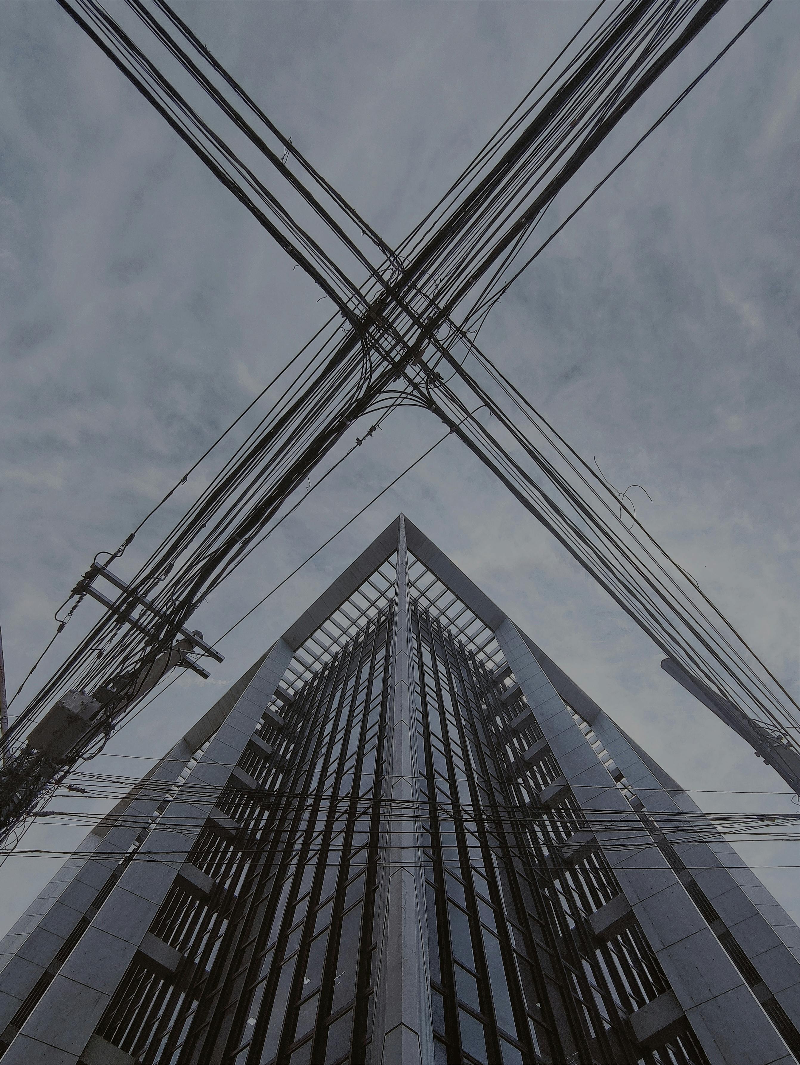 Power Lines near Building Corner · Free Stock Photo