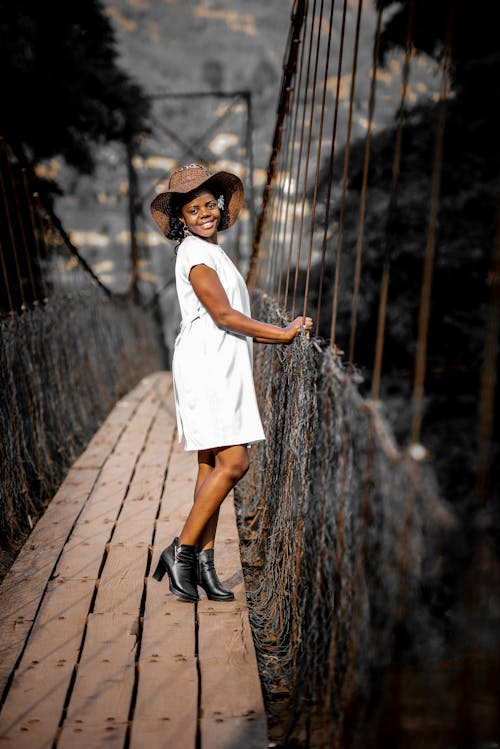 Young Woman Posing on a Suspension Bridge