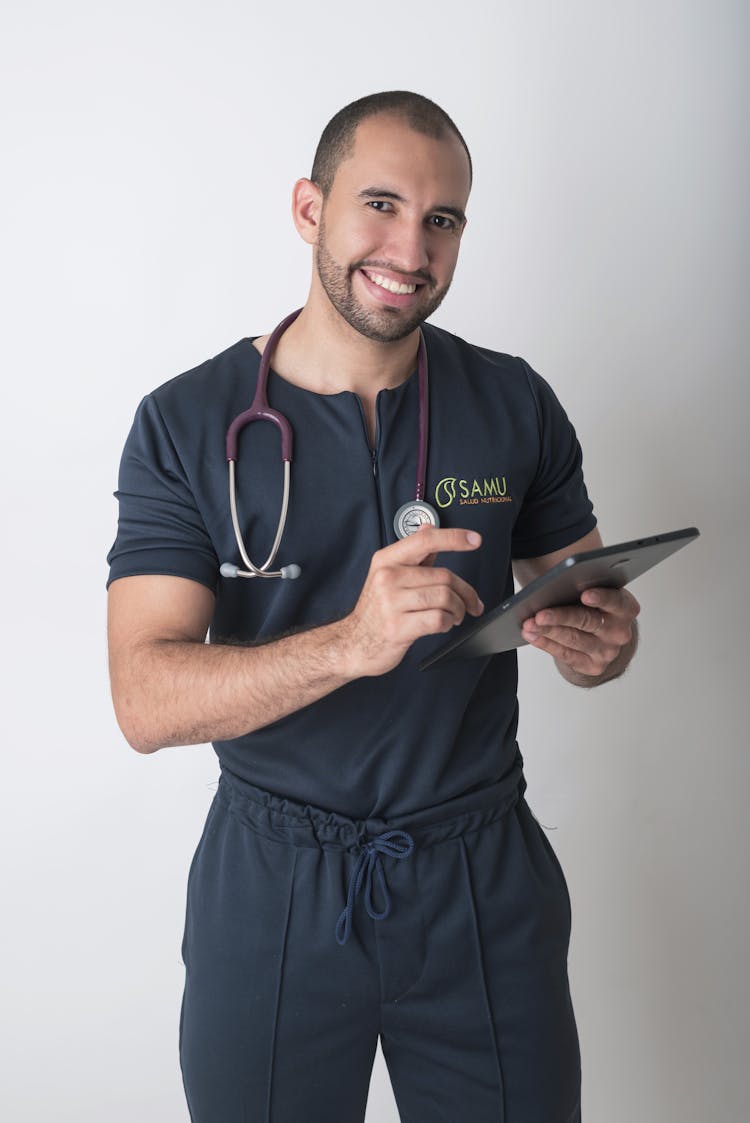 Doctor With Stethoscope And Tablet