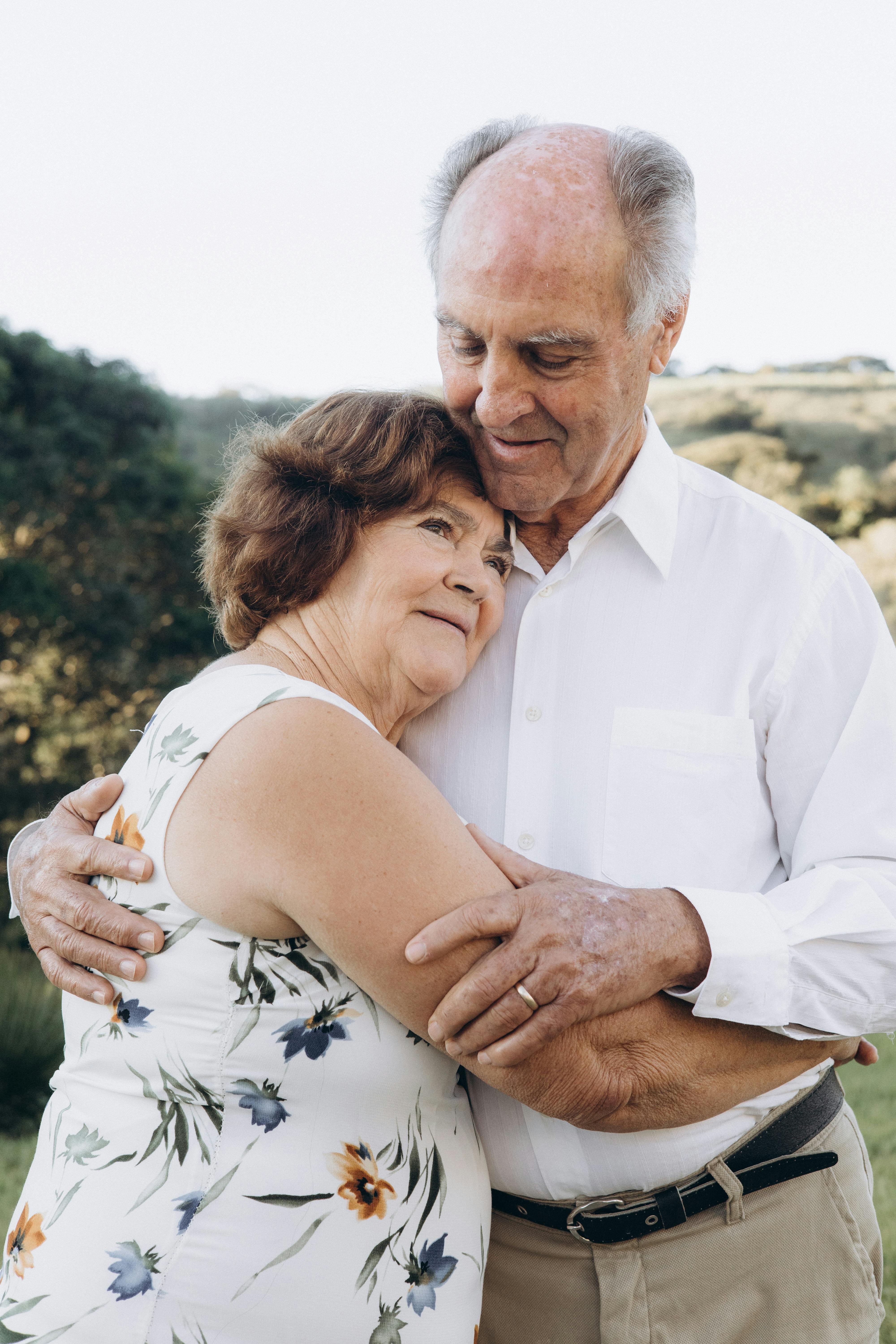 Heartwarming portrait of an elderly couple embracing outdoors in SP, Brazil.