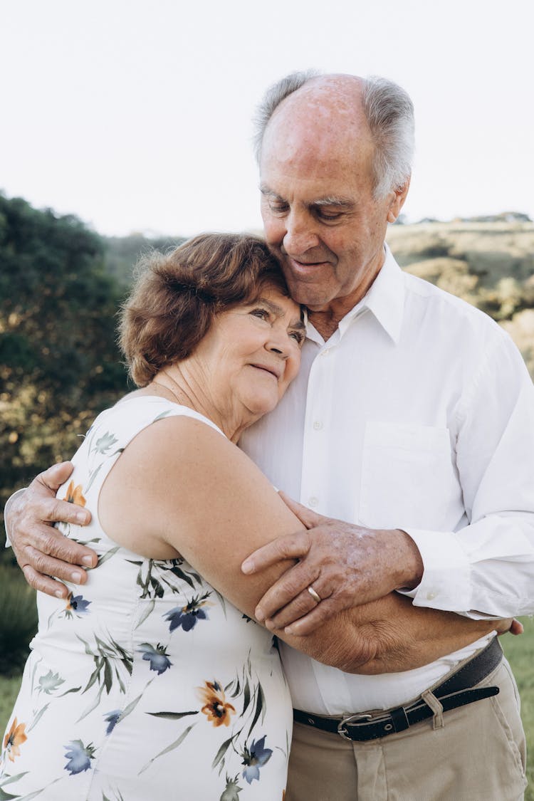 Elderly Man And Woman Hugging