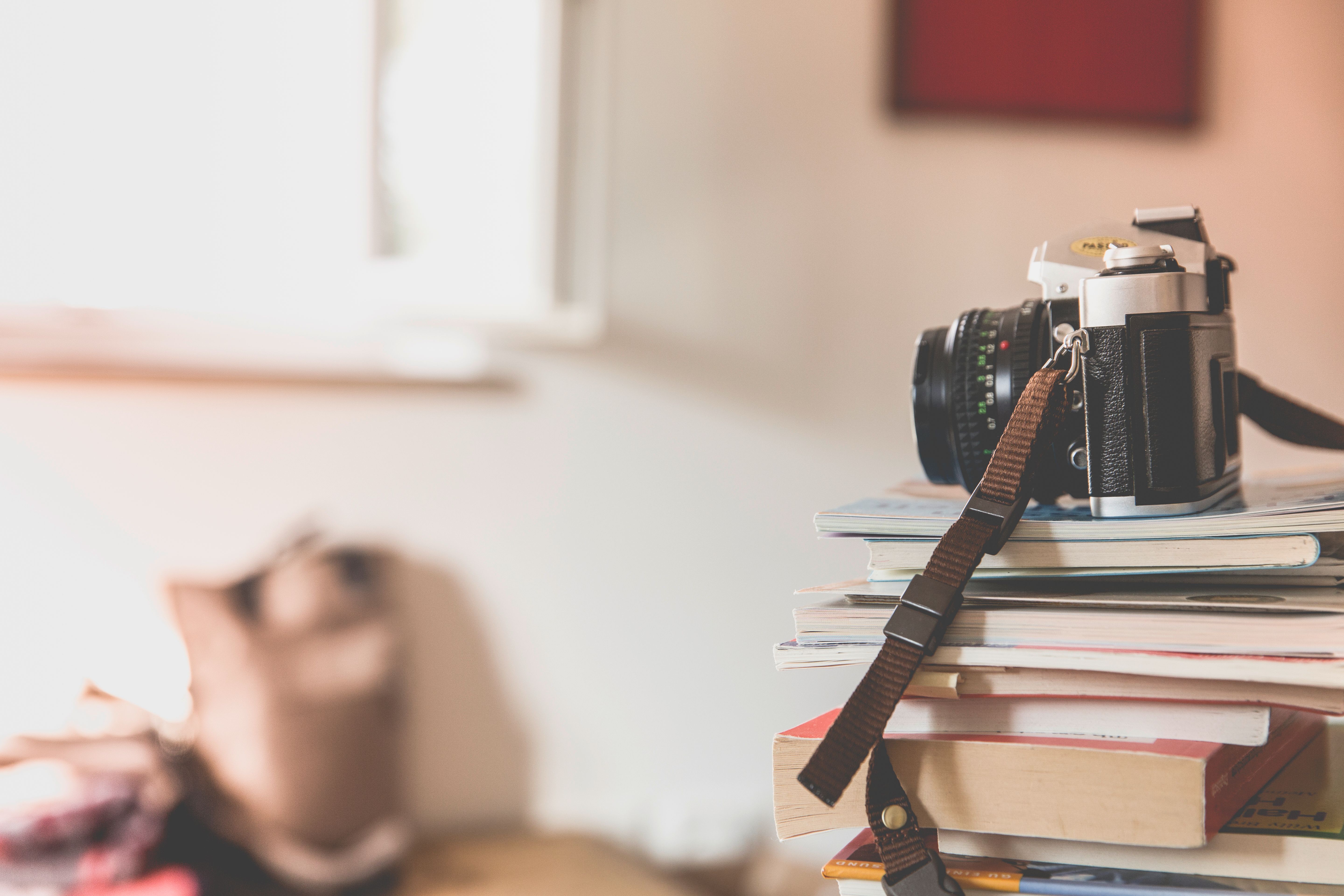 Free stock photo of books, camera, depth of field