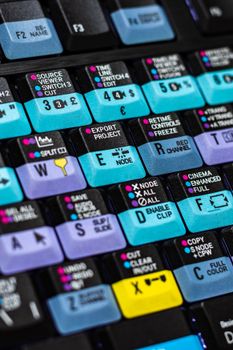 Detailed shot of a colorful keyboard with labeled editing keys for video software functions.