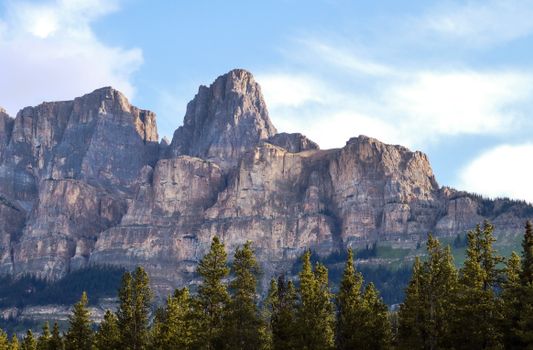 Scenic view of rugged mountains and forest in Banff National Park, Canada.