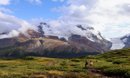 Free Explore the stunning Athabasca Glacier in Jasper National Park, showcasing majestic mountains and lush greenery. Stock Photo