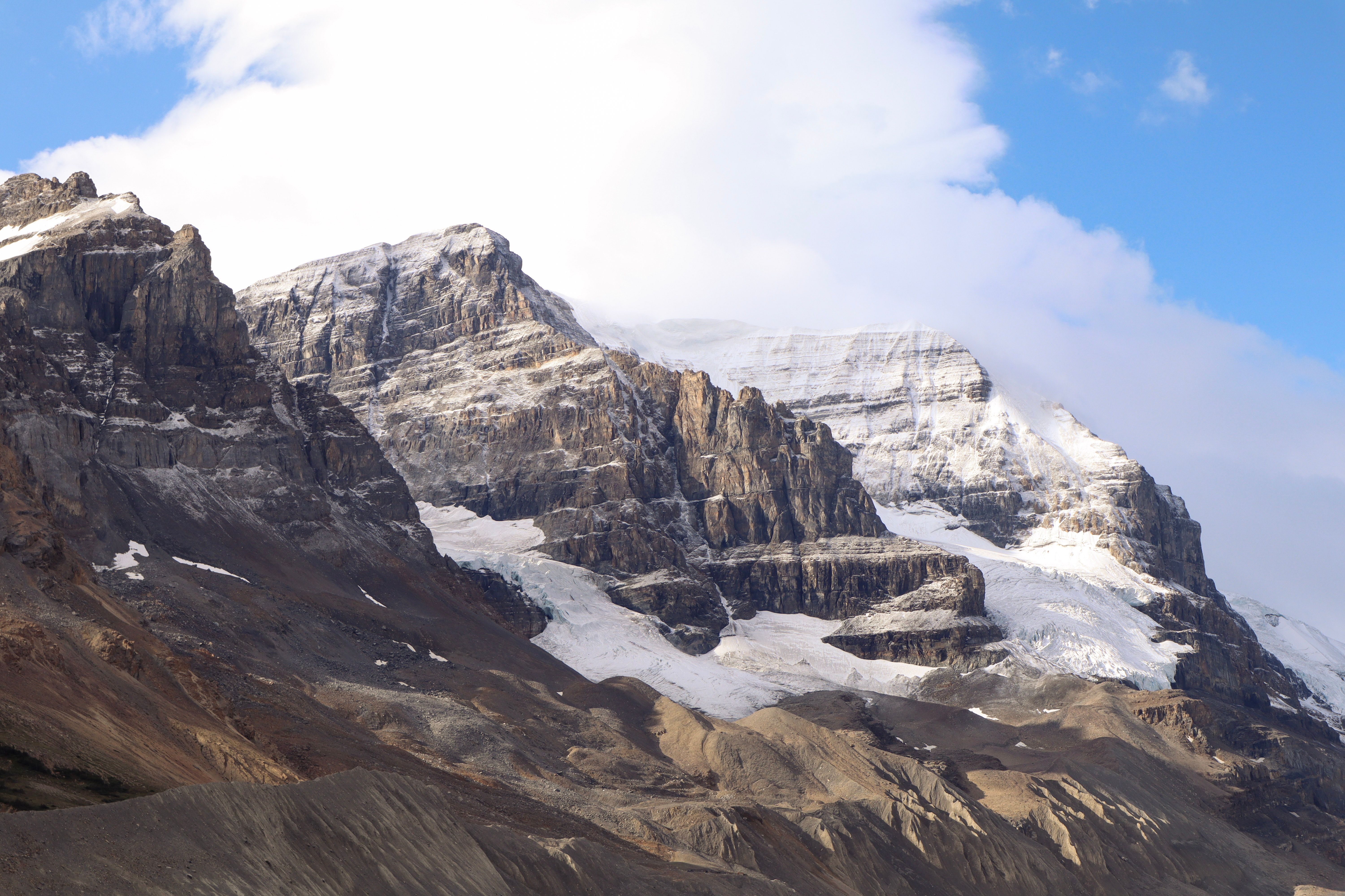 Rock climbers scaling a cliff in the Canadian Rockies