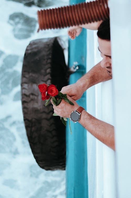 A Man Holding Red Roses 